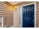 Condo entry with a blue door and light fixture at 261 Quail Run, Roswell, GA 30076