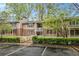 Condo building with a wooden walkway and parking lot at 261 Quail Run, Roswell, GA 30076