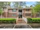 Two story condo building with a wooden walkway at 261 Quail Run, Roswell, GA 30076