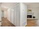Hallway with white closets and wood flooring at 261 Quail Run, Roswell, GA 30076