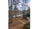 Peaceful path leads to a lake with wooded area at 261 Quail Run, Roswell, GA 30076