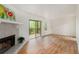 Living room with fireplace and access to a deck at 261 Quail Run, Roswell, GA 30076