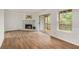 Living room with fireplace, wood floors and deck access at 261 Quail Run, Roswell, GA 30076