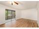 Bright living room features wood-look floors and access to private patio at 261 Quail Run, Roswell, GA 30076