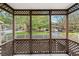 Screened porch overlooking a wooded area at 261 Quail Run, Roswell, GA 30076
