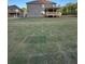 A spacious backyard with an attached wooden patio at 3030 Fairway Dr, Villa Rica, GA 30180