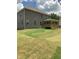 A spacious backyard with an attached wooden patio at 3030 Fairway Dr, Villa Rica, GA 30180