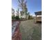 Expansive backyard with newly laid sod and a covered deck perfect for outdoor entertaining and summer relaxation at 3030 Fairway Dr, Villa Rica, GA 30180