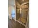 A modern bathroom with a tiled glass shower and a separate soaking tub at 3030 Fairway Dr, Villa Rica, GA 30180