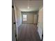 Well-lit bedroom with neutral carpeting and paint and two entry doors at 3030 Fairway Dr, Villa Rica, GA 30180