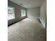 Bright bedroom featuring two windows and neutral paint at 3030 Fairway Dr, Villa Rica, GA 30180