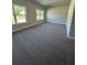 Bright and spacious bedroom featuring two windows and plush neutral carpeting at 3030 Fairway Dr, Villa Rica, GA 30180