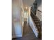Elegant entryway with hardwood floors and an ornate staircase at 3030 Fairway Dr, Villa Rica, GA 30180