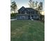 Charming two-story home with manicured front yard and landscape at 3030 Fairway Dr, Villa Rica, GA 30180