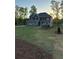 Two-story home with a large front yard and fresh landscaping at 3030 Fairway Dr, Villa Rica, GA 30180