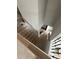 An unfinished staircase is showcased, featuring wrought iron spindles and a wood handrail, awaiting the final touches at 3030 Fairway Dr, Villa Rica, GA 30180