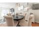 Chic dining room with stylish lighting, hardwood floors, and comfortable seating at 111 Swanton Hill Ct, Decatur, GA 30030