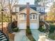 Inviting two-story home featuring twin stairways, individual garages, and classic architectural details at 111 Swanton Hill Ct, Decatur, GA 30030