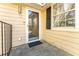 Entrance with glass storm door and front window with dark shutters at 111 Swanton Hill Ct, Decatur, GA 30030