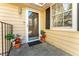 A welcoming home entrance with potted plants and a clear storm door at 111 Swanton Hill Ct, Decatur, GA 30030