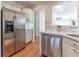 Modern kitchen with stainless steel appliances, white cabinets, hardwood floors, and open design at 111 Swanton Hill Ct, Decatur, GA 30030