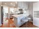 Modern kitchen featuring white cabinets, stainless steel appliances, and eat-in bar with stools at 111 Swanton Hill Ct, Decatur, GA 30030