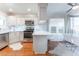 Bright, modern kitchen with stainless appliances, island with bar seating, and hardwood floors at 111 Swanton Hill Ct, Decatur, GA 30030