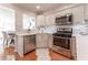 Well-appointed kitchen boasts stainless steel appliances, white cabinetry, and modern backsplash at 111 Swanton Hill Ct, Decatur, GA 30030