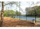 Well-maintained tennis court with surrounding fence and benches at 111 Swanton Hill Ct, Decatur, GA 30030