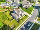 Aerial view of the property showcasing the landscaped yard, fenced backyard, and neighborhood at 1927 Streamlet Xing, Kennesaw, GA 30152