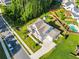 Aerial view of the property showcasing the landscaped yard, fenced backyard, and neighborhood at 1927 Streamlet Xing, Kennesaw, GA 30152