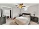 Cozy bedroom features a ceiling fan, neutral decor, and carpeted floor at 1927 Streamlet Xing, Kennesaw, GA 30152