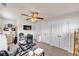 Bedroom with ceiling fan, closet with double doors, and space for an office or craft area at 1927 Streamlet Xing, Kennesaw, GA 30152