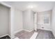 Spacious bedroom with gray vinyl flooring and a window with blinds at 165 Holly Nw Rd, Atlanta, GA 30314