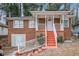 Brick ranch house with a covered porch, steps, and a detached garage at 165 Holly Nw Rd, Atlanta, GA 30314