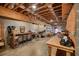 Unfinished basement space with exposed ceiling, workbench, and storage, perfect for a workshop at 49 Holly Springs Ne Rd, White, GA 30184
