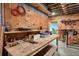 Unfinished basement with workbench and shelving, offering great storage and workspace potential at 49 Holly Springs Ne Rd, White, GA 30184