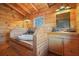 Rustic bathroom with wood paneled walls and a drop-in soaking tub at 49 Holly Springs Ne Rd, White, GA 30184