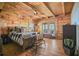 Bedroom featuring wood walls, hardwood floors, a ceiling fan and outdoor views at 49 Holly Springs Ne Rd, White, GA 30184
