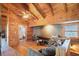 Bonus room featuring wood floors, wood walls, vaulted ceiling, natural light, and access to a bathroom at 49 Holly Springs Ne Rd, White, GA 30184