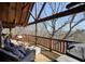Relax on the outdoor deck with wicker chairs and enjoy the beautiful views surrounding the home at 49 Holly Springs Ne Rd, White, GA 30184