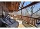 Outdoor deck with wicker furniture set perfect for entertaining or enjoying the surrounding scenery at 49 Holly Springs Ne Rd, White, GA 30184