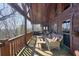 Relaxing outdoor deck offers stunning views and comfortable seating with wicker furniture at 49 Holly Springs Ne Rd, White, GA 30184