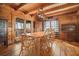 Warm dining room with hardwood floors, wooden table with 8 chairs and a view of the outside at 49 Holly Springs Ne Rd, White, GA 30184