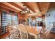 Well-lit dining room with hardwood floors and views to the kitchen at 49 Holly Springs Ne Rd, White, GA 30184