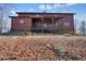 Charming log cabin with a covered porch, set on a hillside with natural surroundings at 49 Holly Springs Ne Rd, White, GA 30184