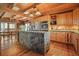 Rustic kitchen with stone kitchen island, stainless appliances and hardwood floors and ceilings at 49 Holly Springs Ne Rd, White, GA 30184