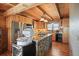 Well-designed kitchen with stainless steel appliances, wooden cabinets, and granite countertops at 49 Holly Springs Ne Rd, White, GA 30184
