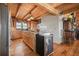 Rustic kitchen featuring wood countertops, cabinets, floors, and a kitchen island at 49 Holly Springs Ne Rd, White, GA 30184