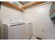 Functional laundry room featuring a modern LG washer and dryer set, with convenient shelving above at 49 Holly Springs Ne Rd, White, GA 30184